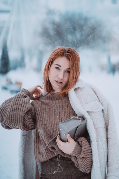 A Joyful Winter Photoshoot with Friends and a Vibrant Coat